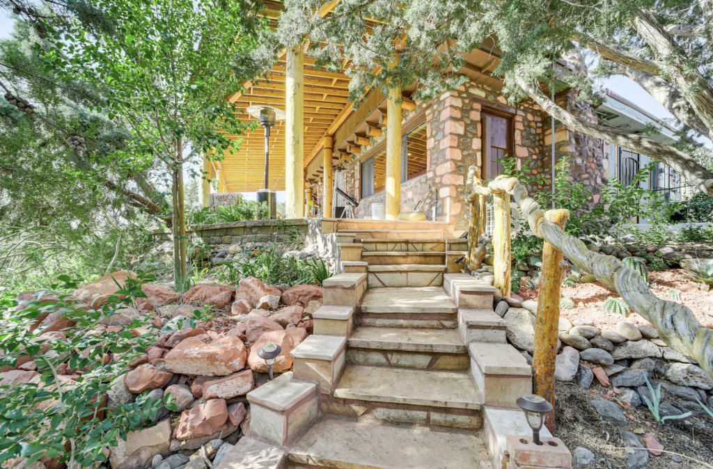 Front of house with stone and greenery